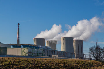 Dukovany Nuclear Power Plant in the Czech Republic, Europe. Smoke cooling towers. There are clouds...