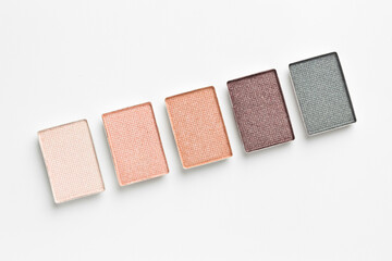 Beautiful eyeshadow refill pans on white background, flat lay