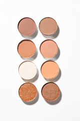 Beautiful eyeshadow refill pans on white background, flat lay
