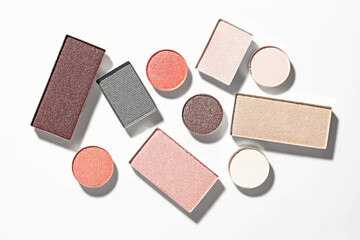 Beautiful eyeshadow refill pans on white background, flat lay