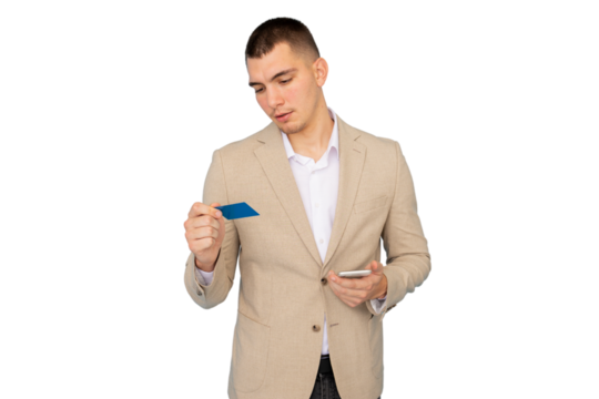 Young businessman holding credit card and smartphone, making online payment on transparent background - Powered by Adobe