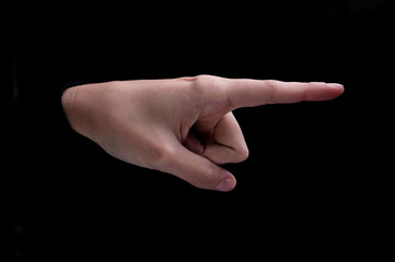 Female hand of caucasian woman pointing fingers to the right side on black background
