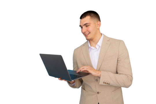 Young businessman smiling while typing on a laptop, showcasing professional skills in a modern, transparent background setting