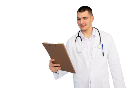 Young male doctor in lab coat with stethoscope around neck smiling while reading notes on a clipboard, isolated on transparent background