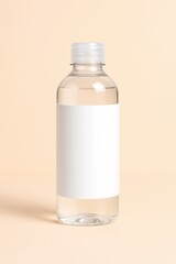 Clear Plastic Bottle with Blank Label on Beige Background