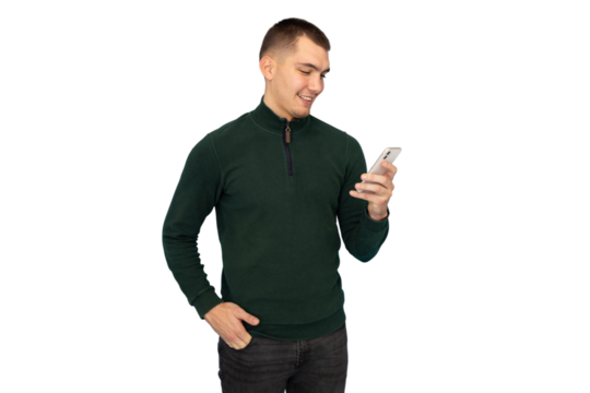 Young man smiling, reading smartphone messages, enjoying digital communication against transparent background