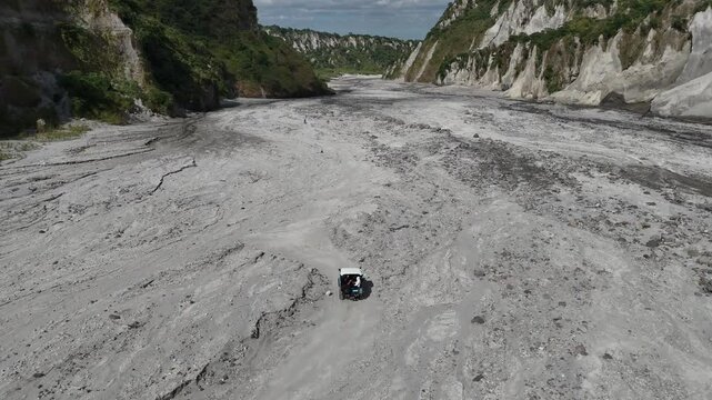 4x4 Vehicle Driving Through Lahar Trail in Mount Pinatubo, Philippines &ndash; Aerial View