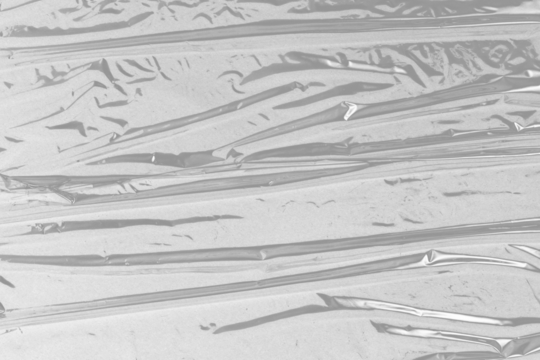 plastic overlay texture of realistic crumpled transparent plastic film wrap on black background,wrinkled stretched plastic effect.