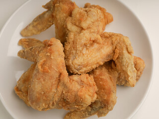 Piled of fried chicken on white background