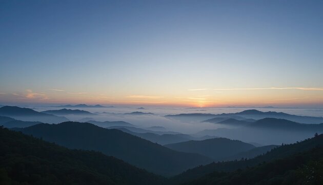 Scenic landscape of mountains at sunrise with a stunning view of the horizon