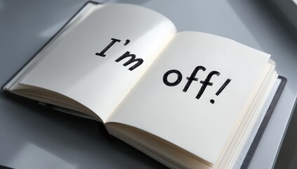 An open book with the words "I'm off!" written in large letters on its pages.