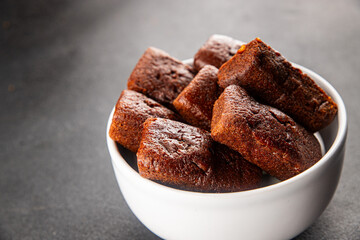 Financier biscuit chocolate cookie sweet dessert fresh delicious gourmet food background on the table rustic food top view copy space