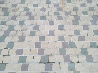 Colorful square pavement tile pattern background