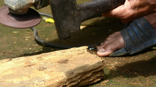 Isolated close up of chef knife sharpening, honing and stropping process by  a skilled craftsman. Vintage old school craftsman at work in grange shop showing true professional skills.