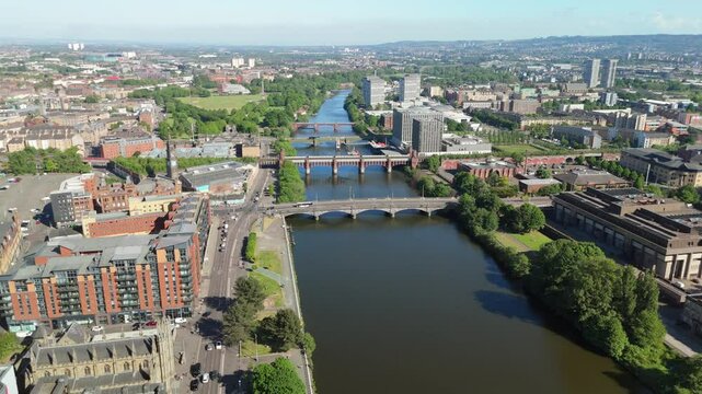 Glasgow Scotland: 18th May 2025: Glasgow City Centre. Bridges over the River Clyde on a sunny day drone footage. With Glasgow Green in background