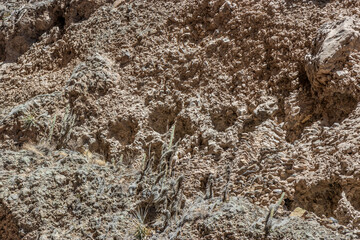 Ancient cliffside tombs near Madrigal village in Colca canyon, Peru