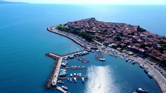 Panoramic drone view of Old Town Nessebar, Bulgaria, on the Black Sea coast. The ancient peninsula features traditional architecture, historic ruins, and medieval towers&mdash;part of UNESCO World Heritage.