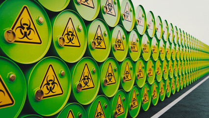 Stacked Green Barrels with Biohazard Signs Warning of Hazardous Waste