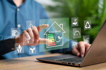 Energy efficiency Improvement, Energy-saving home, Eco concept, Businessman plan eco-friendly home improvements, Sustainable development, Low energy saving and cost reduction, Global Warming Awareness © NongAsimo