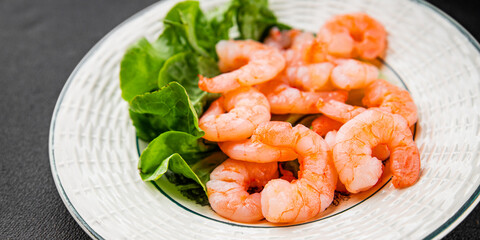 Shrimp salad prawns seafood fresh pescetarian diet gourmet food background on the table rustic food top view copy space keto and paleo diet vegetarian food