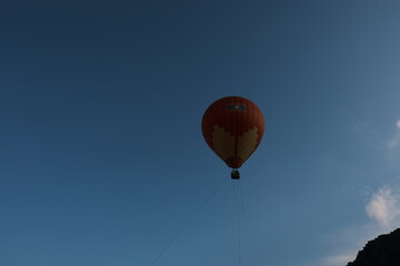 A hot air balloon is in the air