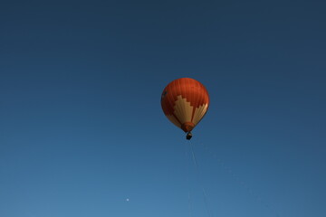 A hot air balloon is in the air