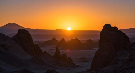 Fototapeta premium Desert Sunrise: A breathtaking sunrise paints the sky in vibrant oranges and yellows, casting long shadows across the dramatic rock formations of a desolate desert landscape.