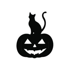 Black cat sitting on halloween jack o lantern pumpkin