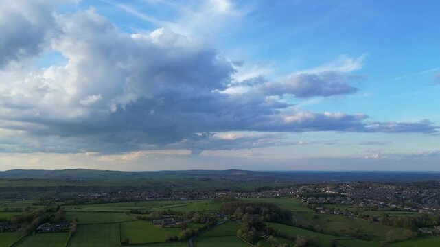High Angle View of British Agricultural Farms at Countryside and Beautiful Landscape of Near Hills of Rotherham, England Great Britain of UK. April 30th, 2024.  Drone's Camera Footage