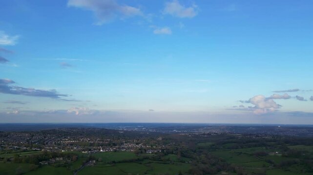 High Angle View of British Agricultural Farms at Countryside and Beautiful Landscape of Near Hills of Rotherham, England Great Britain of UK. April 30th, 2024.  Drone's Camera Footage