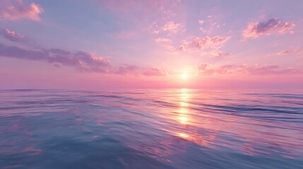 Obraz premium Serene sunset over a tranquil ocean.