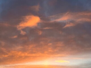 Sky is painted with beautiful sunset colors of orange, pink, and purple.