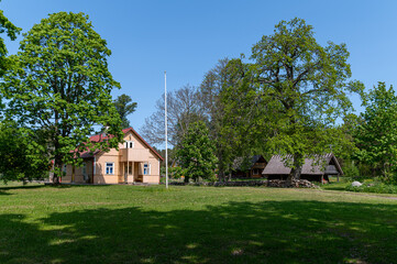 Visit to Ruhnu Island showcases traditional Estonian houses surrounded by lush greenery