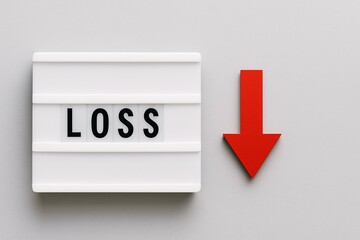 Financial Loss Concept with Red Arrow and Loss Text on Lightbox