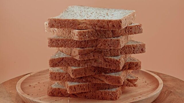 Multigrain bread sliced on wooden plate. Loaf of Bread.