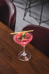 Strawberry-Flavored Pink Dessert in Decorative Glass Dish - Sweet Pink Strawberry Mousse Served Elegantly in Dessert Glass