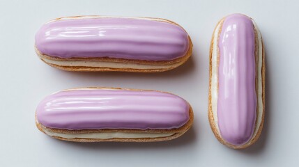 Flat lay of minimalist eclairs with lavender glaze, isolated on light backdrop