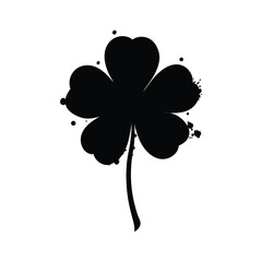 Black silhouette of a four leaf clover with paint splatter design on white background