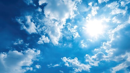 Obraz premium Vibrant High Noon Sunlight Blue Cloudy Sky Background – Blinding Sun Rays, Cerulean Skies, Luminous Cloud Textures, Energetic Midday Atmosphere