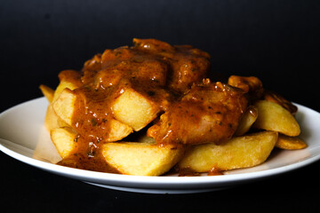 Plate Of British Favourite Chicken Curry And Chips