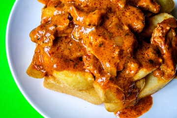 Plate Of British Favourite Chicken Curry And Chips