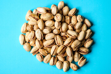 A Pile Or Group Of Healthy Salt and Pepper Pistachio Nuts In Their Shells