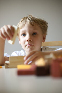 little boy playing with blocks