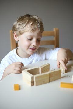 little boy playing with blocks