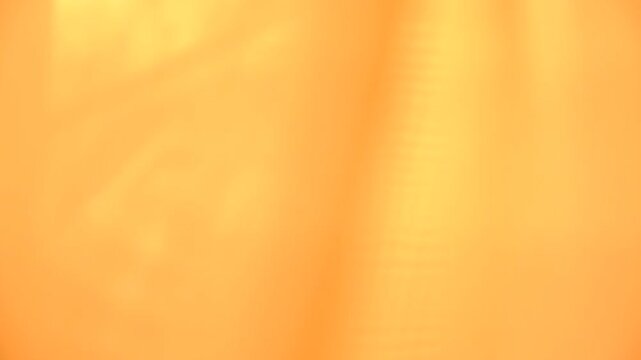 Wall interior background. Light yellow orange backdrops show products with motion shadows. Gradient colors. Background for text and presentation product. Light effect, post production	