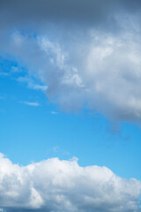 Beautiful Blue Sky Background with White Puffy Clouds. Cloudscape for Nature and Weather Concepts.