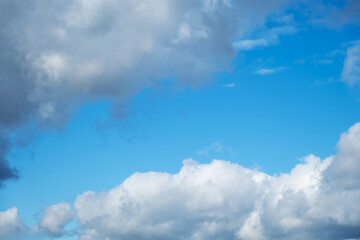 Obraz premium Blue Sky with White and Grey Cumulus Cloud. Clear Weather Background for Summer Season or Environment Concept.
