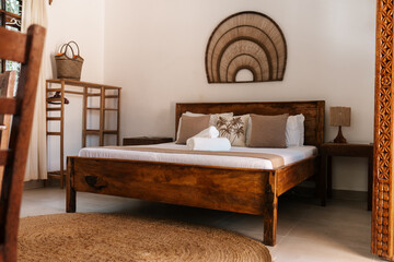 Hotel bedroom interior, Zanzibar Tanzania African decor, mango wood bed