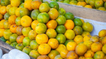 Neat arrangement of sweet and ripe yellow oranges