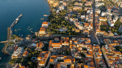  Top-down drone view of the historic center of Sorrento, Italy, with its iconic terracotta rooftops and coastal charm. A perfect blend of architecture, culture, and sea